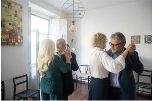 group of older people dancing and being social